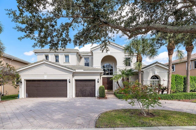 mediterranean / spanish-style house featuring a garage