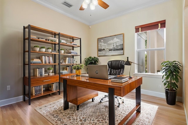 office featuring hardwood / wood-style flooring, ceiling fan, and ornamental molding