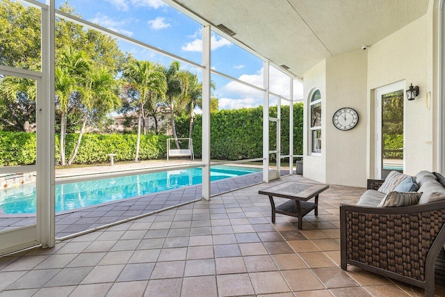 view of pool with a patio area and an outdoor living space