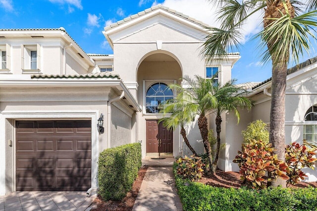 mediterranean / spanish-style house featuring a garage