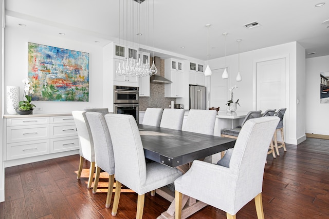 dining space featuring dark hardwood / wood-style flooring