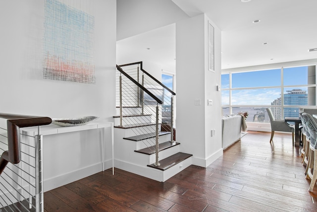 stairway featuring hardwood / wood-style floors