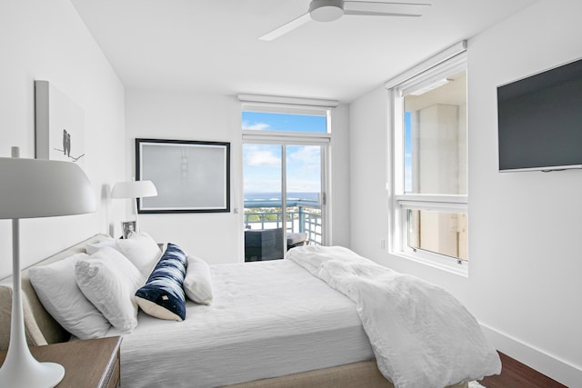 bedroom featuring ceiling fan, access to exterior, and hardwood / wood-style floors