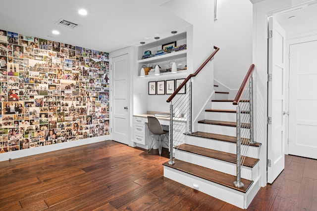 stairs featuring hardwood / wood-style flooring