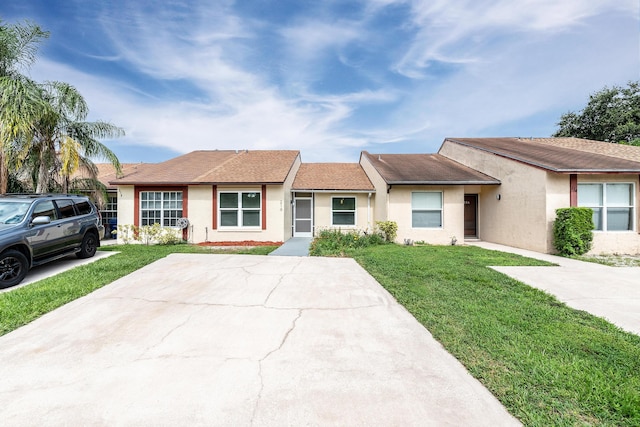 single story home with a front yard