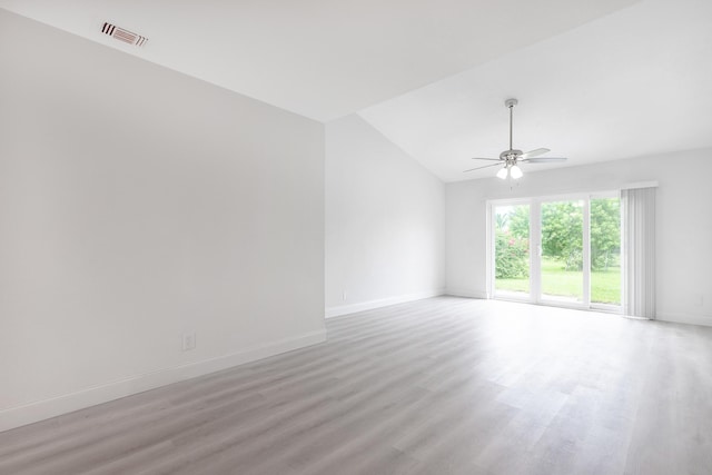 unfurnished room with vaulted ceiling, ceiling fan, and light hardwood / wood-style floors