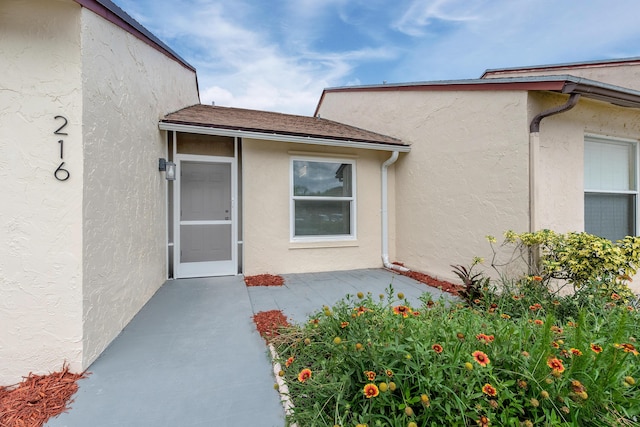 property entrance with a patio