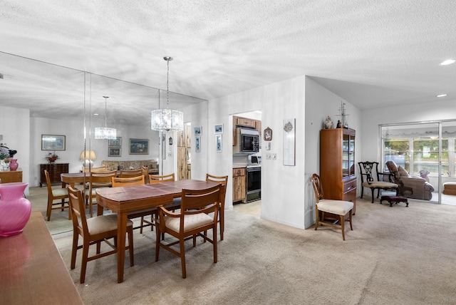 carpeted dining space with a textured ceiling and vaulted ceiling