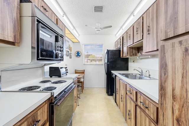 kitchen featuring ceiling fan, sink, a textured ceiling, and black appliances