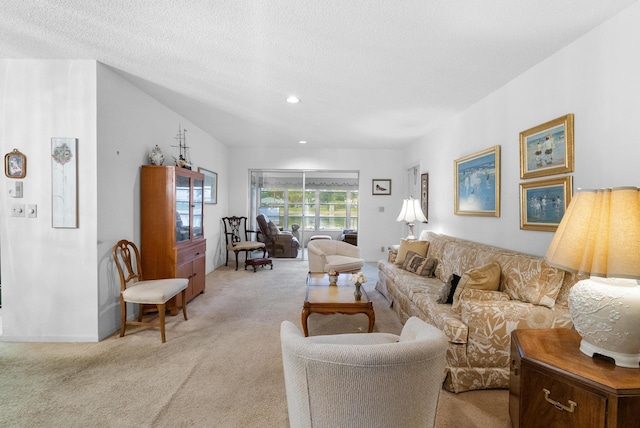 living room with light colored carpet and a textured ceiling