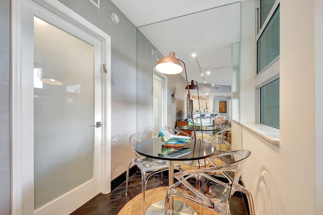 dining room with dark hardwood / wood-style flooring