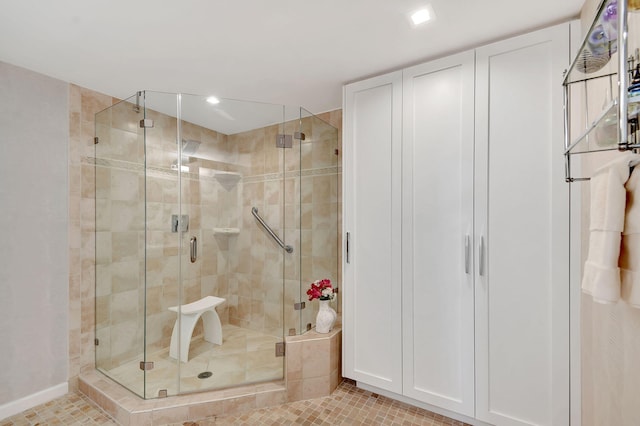 bathroom with walk in shower and tile patterned floors