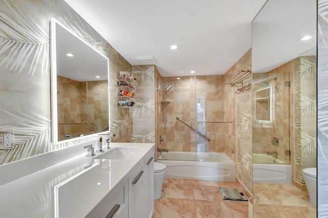 full bathroom featuring toilet, tiled shower / bath combo, tile patterned flooring, and vanity