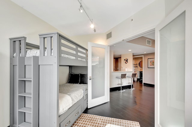 bedroom featuring dark hardwood / wood-style floors