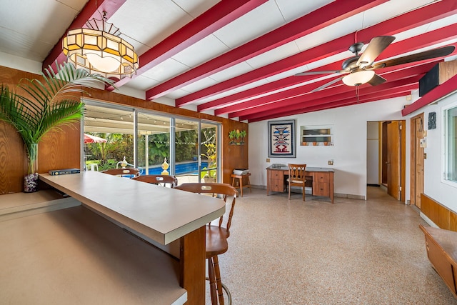 dining room with ceiling fan and vaulted ceiling