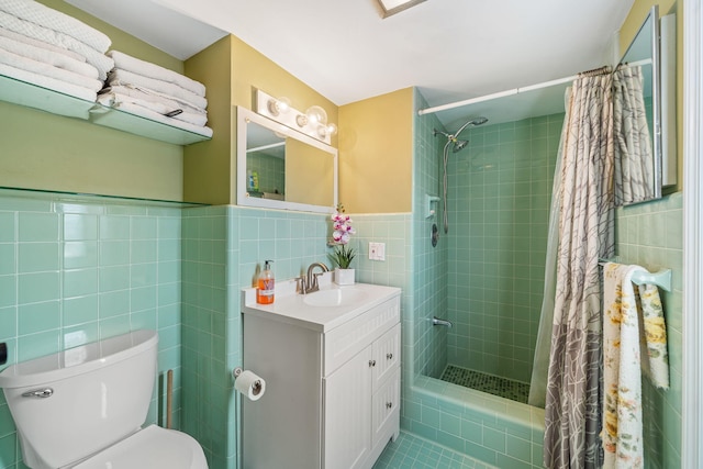 bathroom featuring vanity, curtained shower, tile walls, and toilet