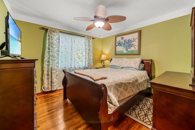 bedroom with hardwood / wood-style flooring and ceiling fan