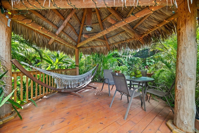 wooden terrace featuring a gazebo