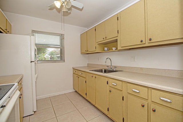 kitchen with ceiling fan, light tile patterned floors, electric stove, and sink