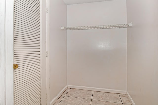 walk in closet featuring light tile patterned floors