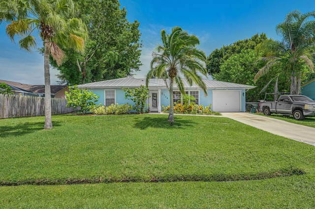 ranch-style home with a front yard and a garage