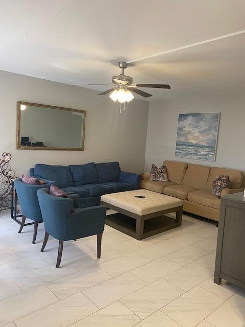 living room featuring ceiling fan