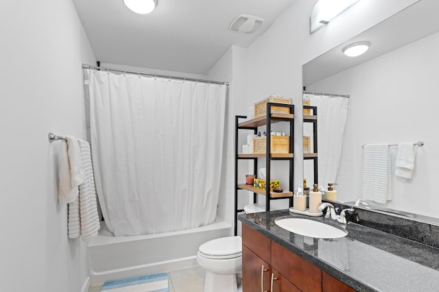 full bathroom featuring vanity, tile patterned floors, shower / bath combo with shower curtain, and toilet