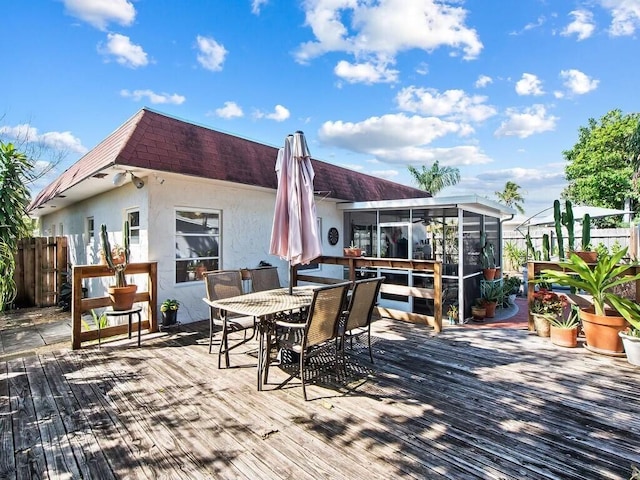 wooden terrace with a sunroom