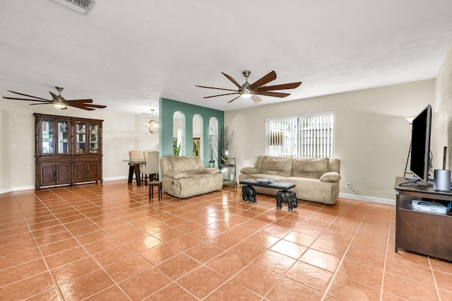 living room featuring light tile patterned flooring and ceiling fan