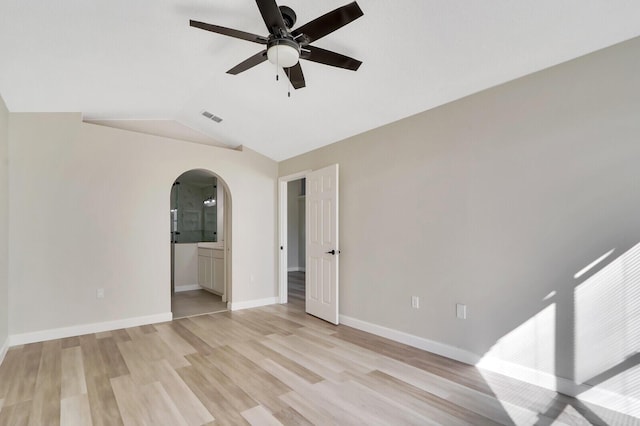 unfurnished room with ceiling fan, light hardwood / wood-style floors, and vaulted ceiling