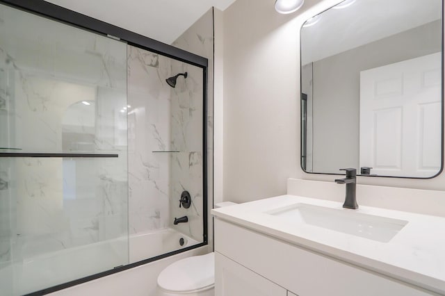 full bathroom with toilet, enclosed tub / shower combo, and vanity