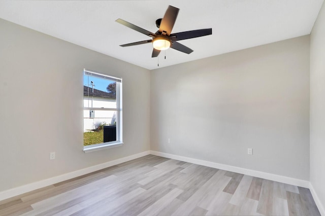 spare room with ceiling fan and light hardwood / wood-style floors