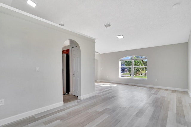 unfurnished room with light hardwood / wood-style flooring