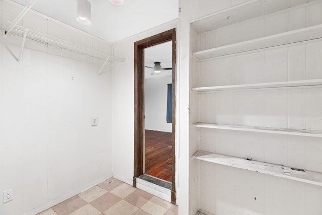 walk in closet featuring ceiling fan