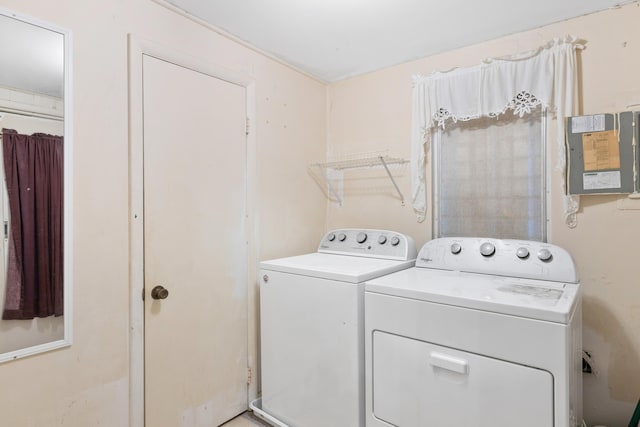 clothes washing area featuring independent washer and dryer