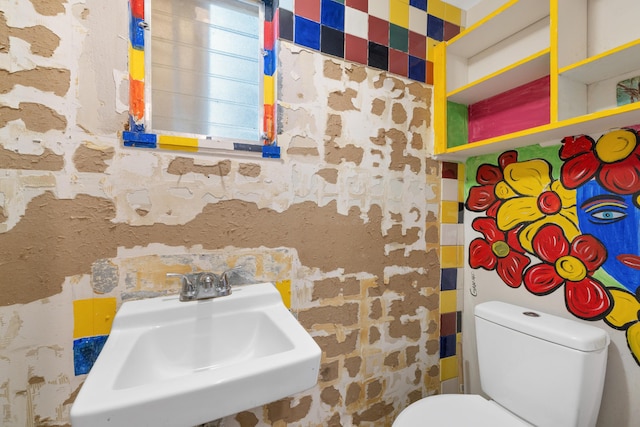 bathroom featuring sink and toilet