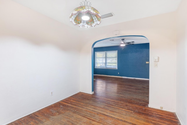 unfurnished room with ceiling fan and dark hardwood / wood-style floors