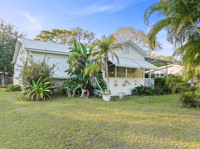 view of home's exterior featuring a yard