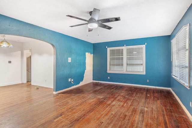 spare room featuring ceiling fan and hardwood / wood-style floors