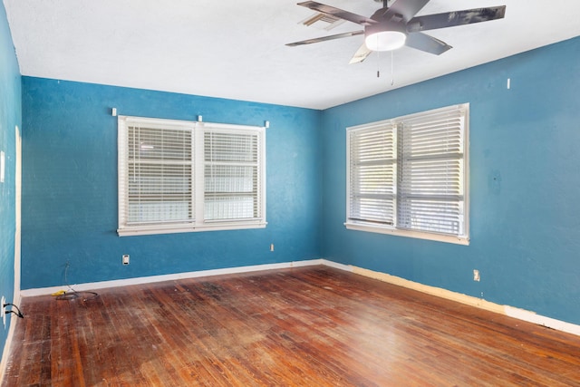 spare room featuring ceiling fan and hardwood / wood-style flooring