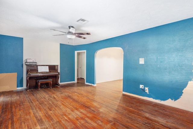 living room with ceiling fan and hardwood / wood-style flooring