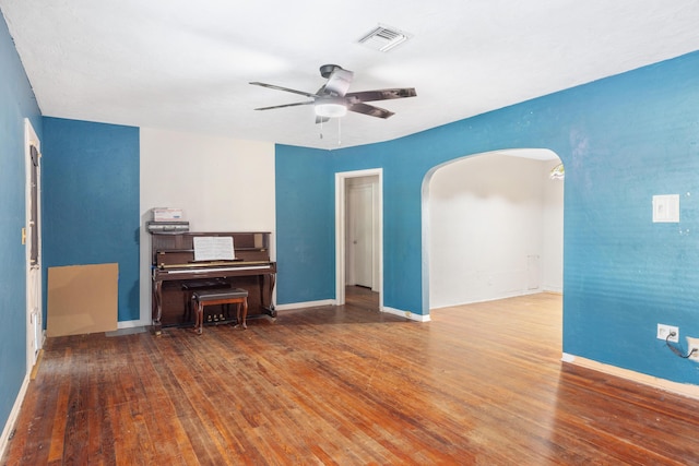 unfurnished living room with ceiling fan and hardwood / wood-style floors