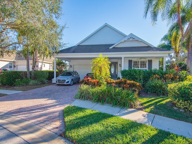 view of front of house with a carport and a garage