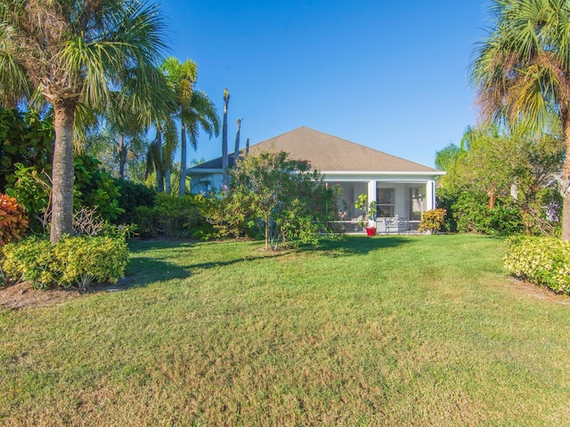 view of yard featuring a sunroom