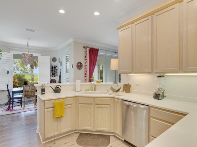 kitchen with sink, dishwasher, kitchen peninsula, light brown cabinetry, and pendant lighting