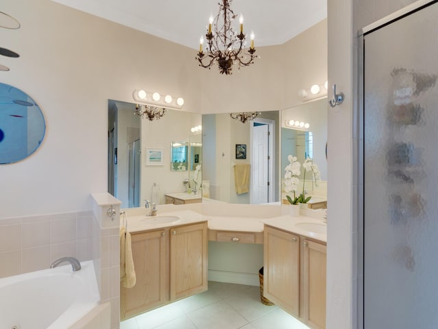 bathroom with a notable chandelier, vanity, plus walk in shower, and tile patterned floors