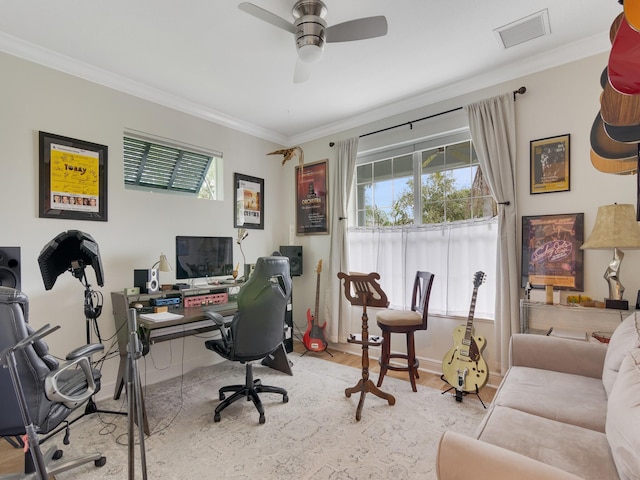 office with ceiling fan, light wood-type flooring, and ornamental molding