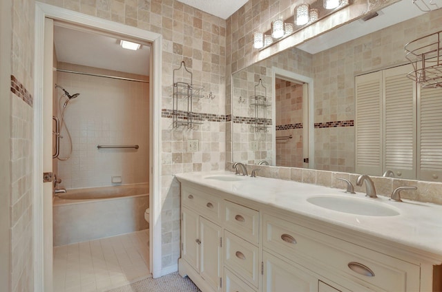 full bathroom featuring tile walls, tile patterned flooring, toilet, and vanity