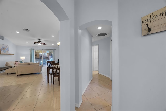 corridor with light tile patterned flooring