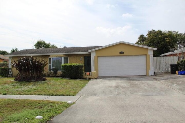 ranch-style home featuring a front yard and a garage